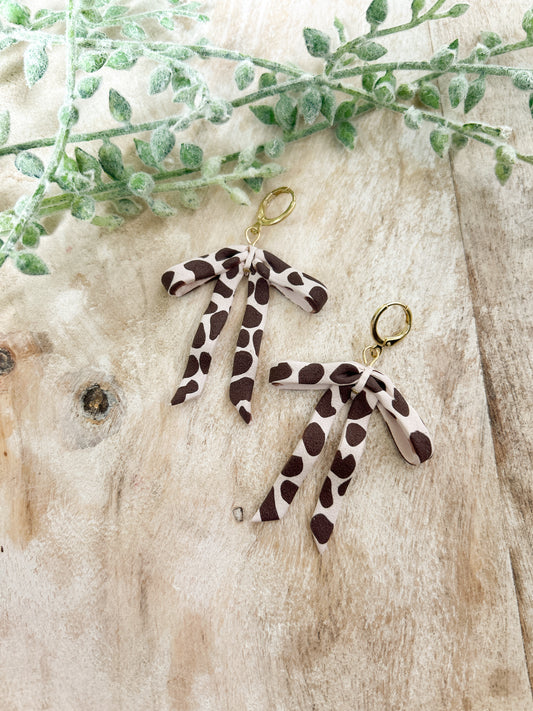 Cow Print Bow Huggies